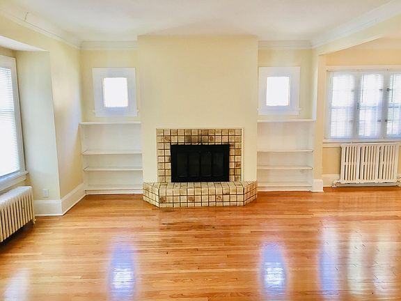 Large living room with natural fireplace.