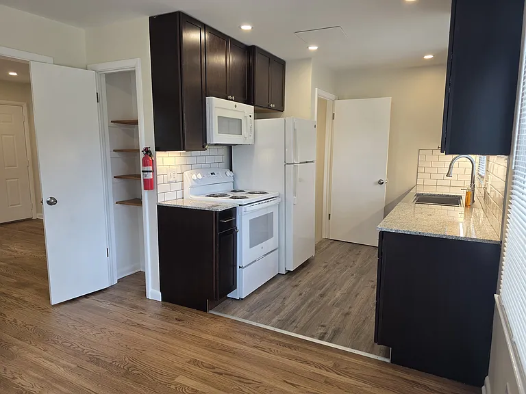 New kitchen cabinets, granite counters, appliances, lighting, flooring and paint.