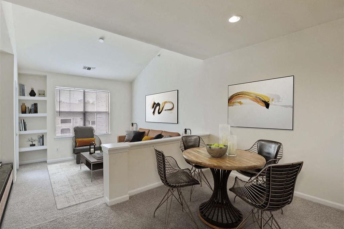 Open dining and living space with natural light
