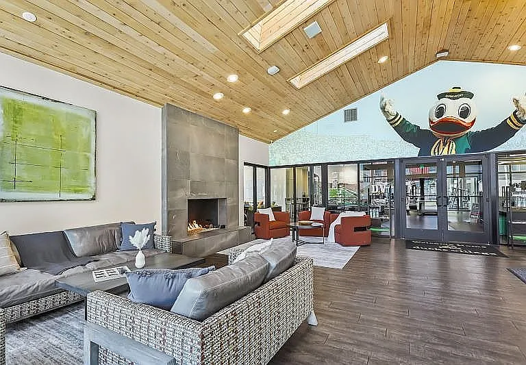 Relax in style in this contemporary lounge, featuring warm wood ceilings and a welcoming atmosphere.
