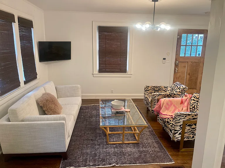 Large living room. Natural light, open to adjacent kitchen.