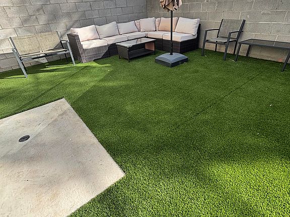 Backyard patio furniture and umbrella (included)