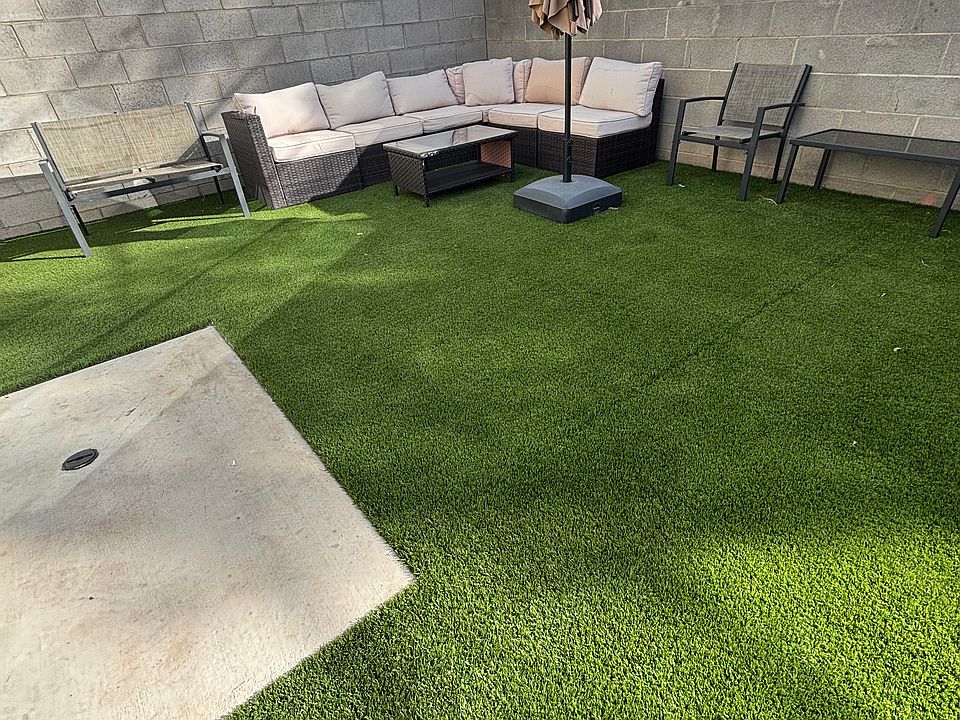 Backyard patio furniture and umbrella (included)