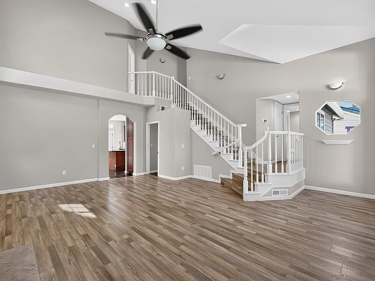 Living Room with Tall Ceiling and abudant natural light