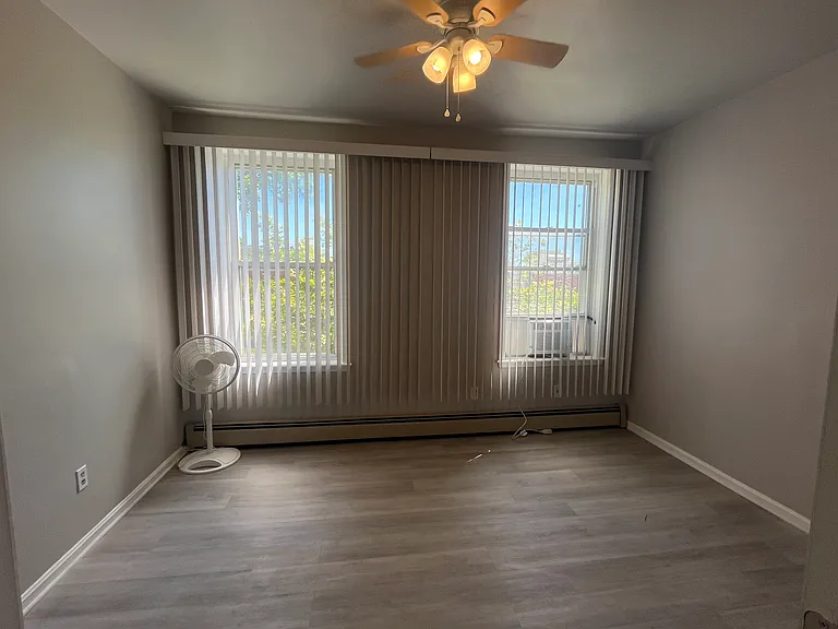 Large bedroom on 1st level with lots of windows for view of park - available