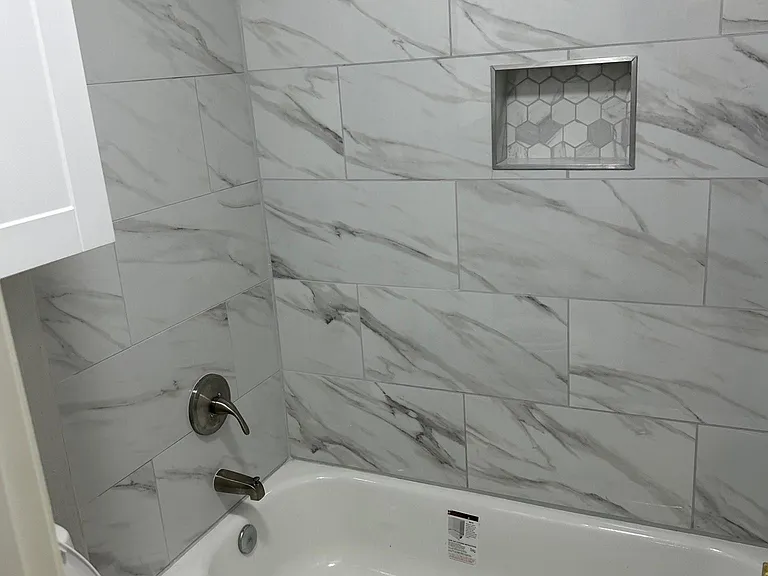 New bath tubs, new tiles around bathtubs, new faucets, new toilets