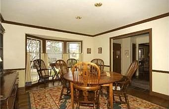 Beautiful hardwood floors & walls of windows overlooking the 3 acre lake.
