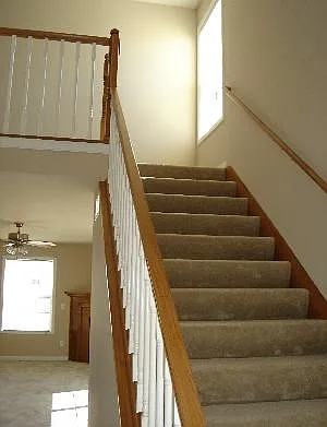 Entrance into Home with wide stair case for easy move in