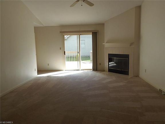 Great room shows fireplace and and sliding doors to new private back deck