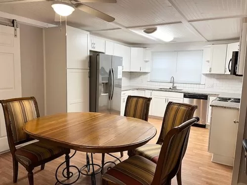 Dining space with open white bright kitchen. - 45 3rd St