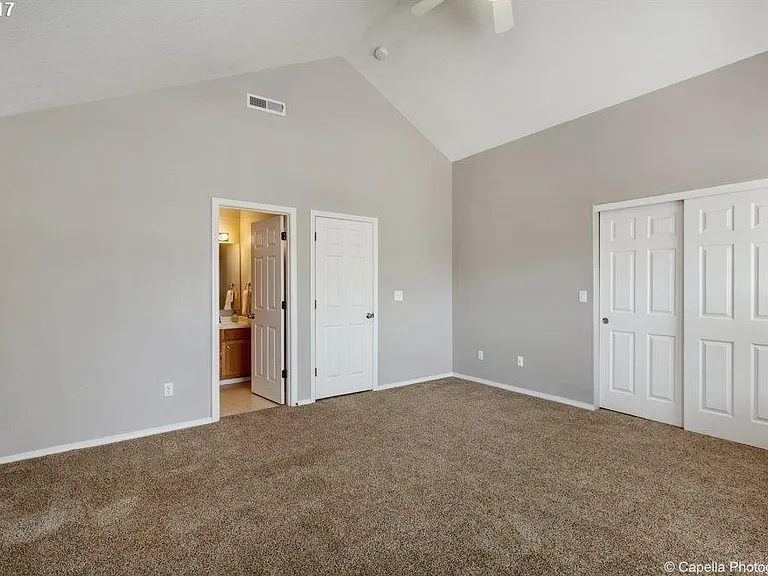 Master suite is light filled , airy with tall vaulted ceiling.