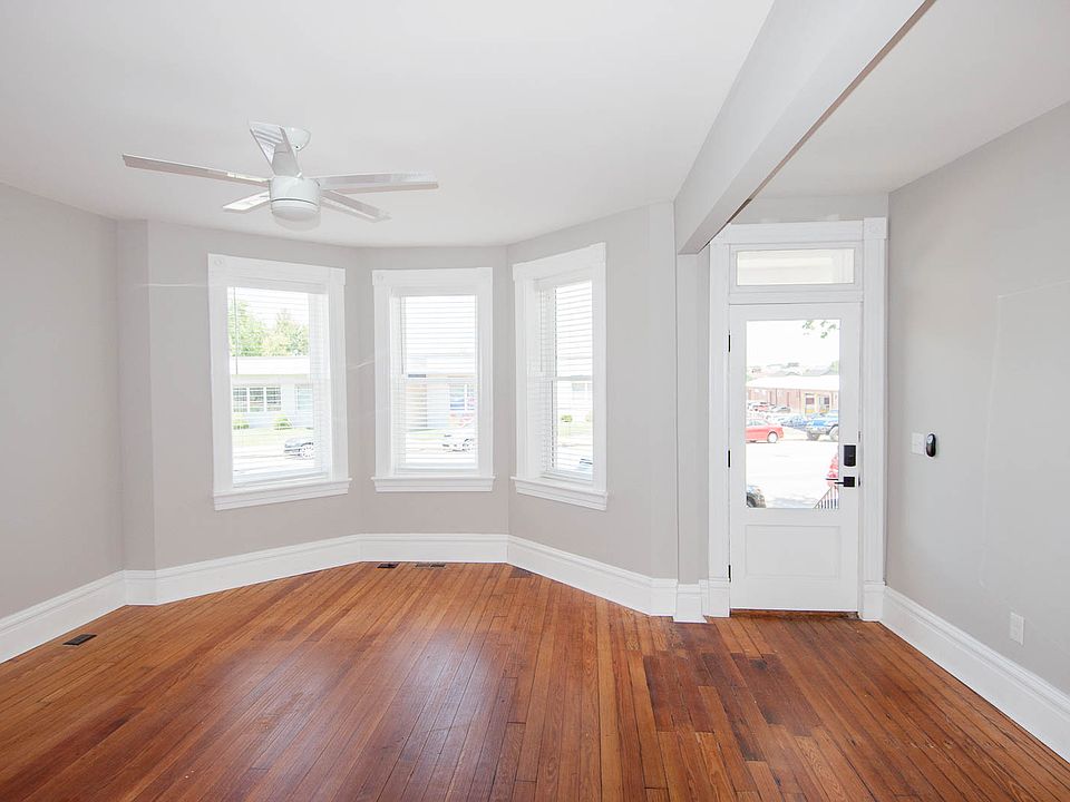 Living area with bay window and front entry