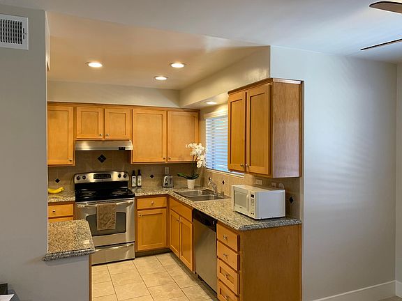 Kitchen with recessed lighting & stainless steel appliances