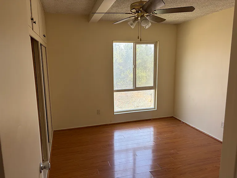 First bedroom with closet and extra storage above