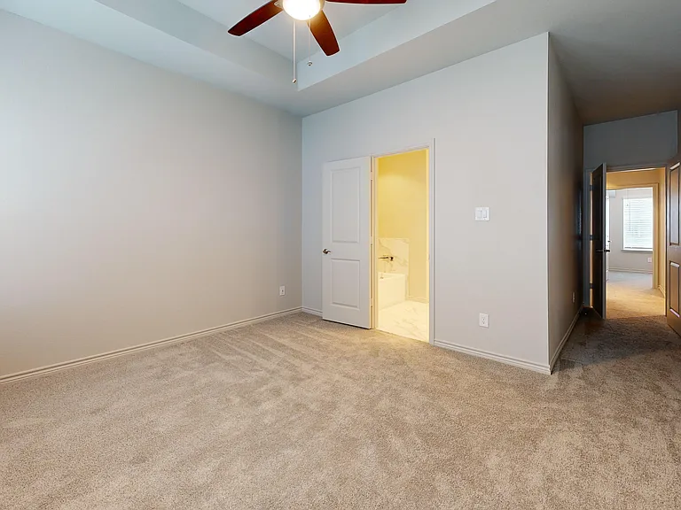 Primary Bedroom with Tray Ceiling and Ensuite