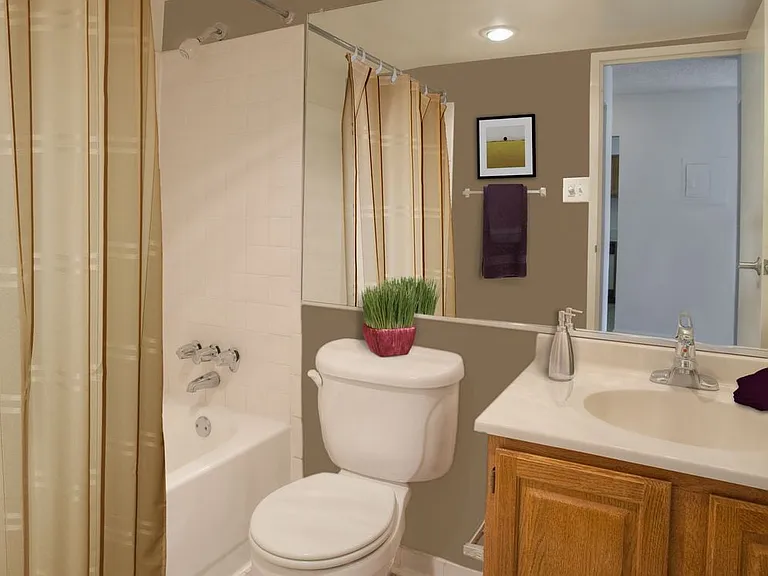 Bathroom with white countertop and tile floor