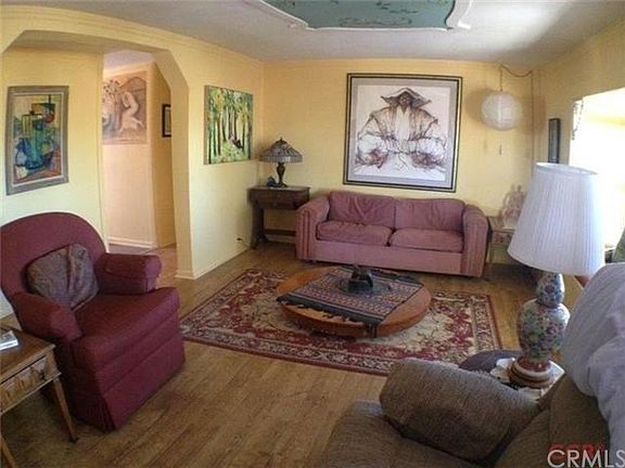 Comfortable living room with bay window that provides lots of light.