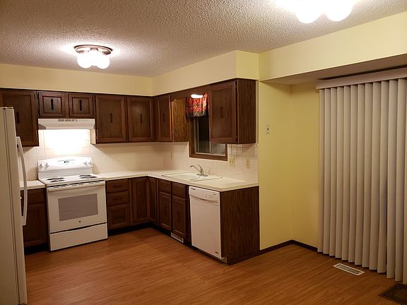 Kitchen with slider door to the back. The large table area is the whole area in front of the slider. The area is a great size for a large table.