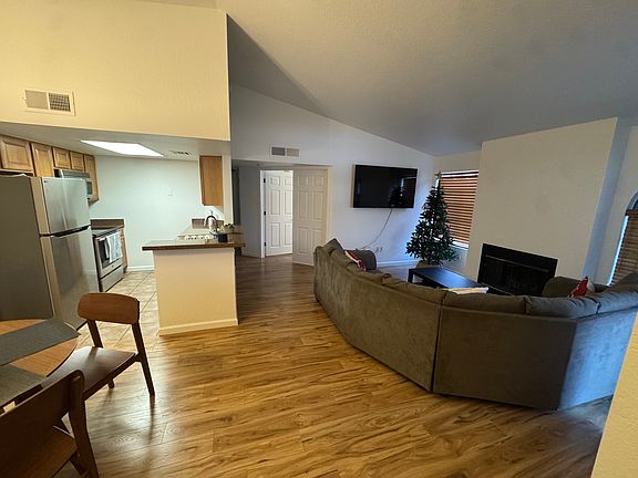 Main living room space with new white paint and flooring
