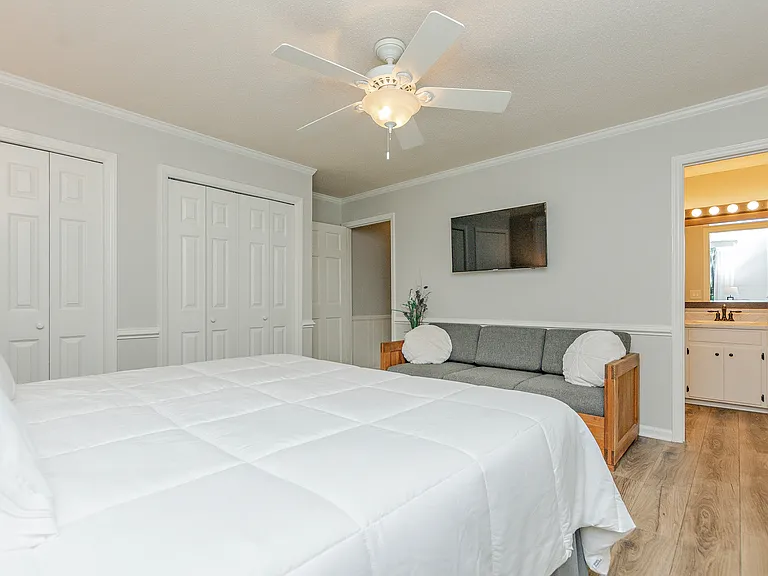 King Master Bedroom looking in the full bath. His and Hers double closets to the left.