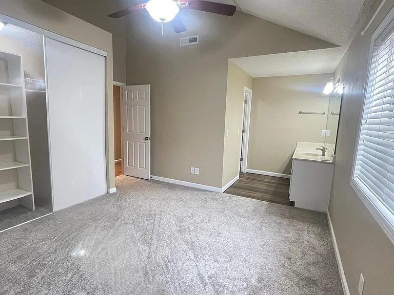Master Bedroom with view of Wall-to-Wall Closet and Bathroom Vanity area
