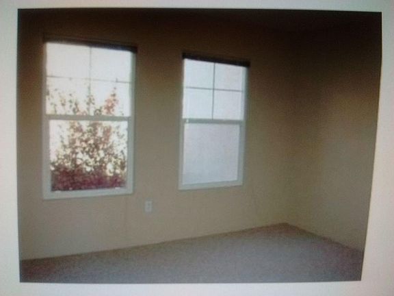 Windows in bedroom looking to a beautiful garden setting an