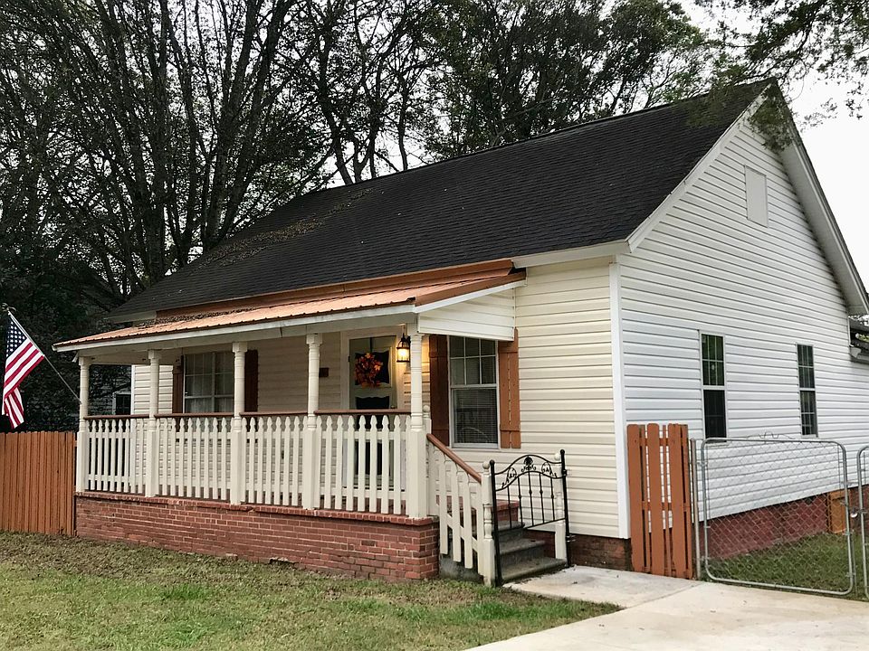 Street View, spacious covered front porch, concrete driveway, fenced back yard