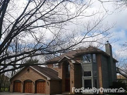 Large .7 acre lot with mature trees : Cedar sided home, 5 separate entry/exits, extra heavy asphalt 