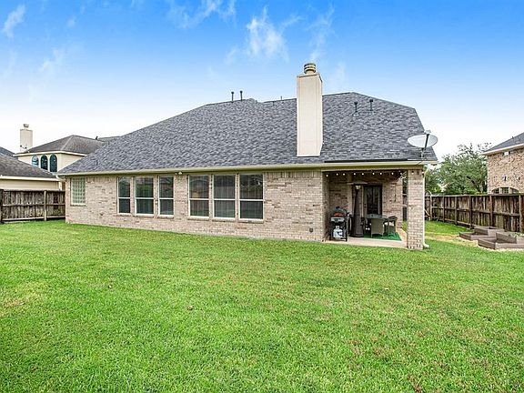 Back yard has plenty of room for the pets and kids or a pool.