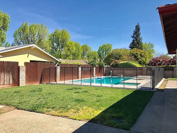 Large backyard w/ built in pool for all your entertaining plans (diving board has been removed)