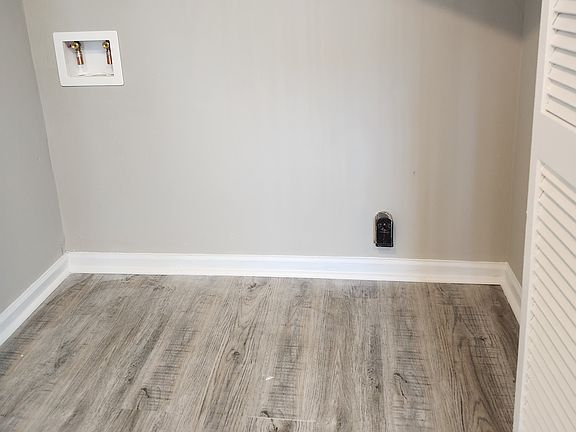 Hook up for washer/dryer. Sliding doors to hide them