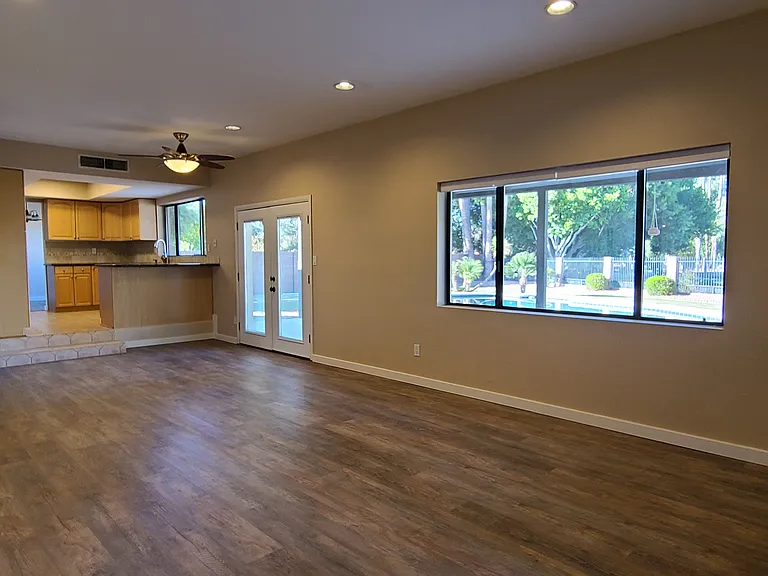 Familyroom open to backyard pool and lake