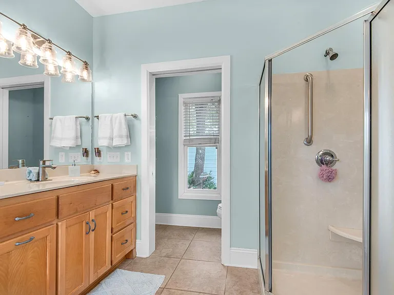 Separate shower and water closet with sliding pocket door