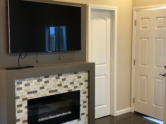 Wall mounted TV is included.