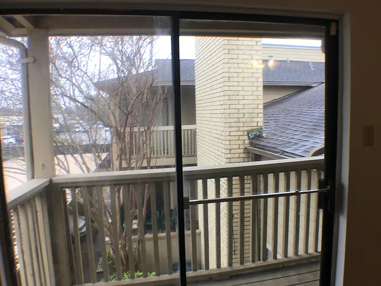 Looking out to the neighborhood from the second-floor bedroom