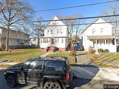 Street view. Apartment includes top 2 top floors