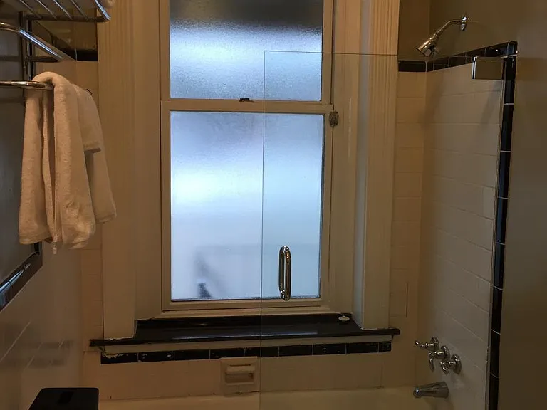 Glass door on the combination shower/tub