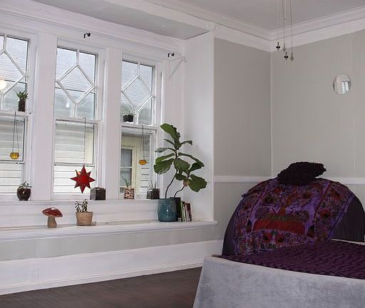 High ceilings and original hard wood floors. We have central heating and air but also have a ceiling fan in the living area and kitchen.