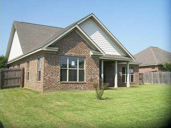 Rear covered porch with fenced back yard