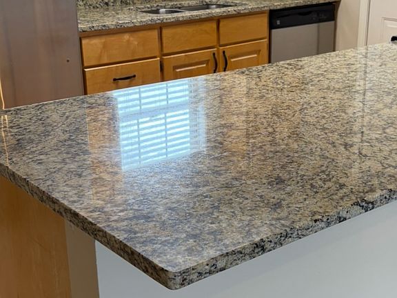 Granite countertop in kitchen and stainless steel appliances