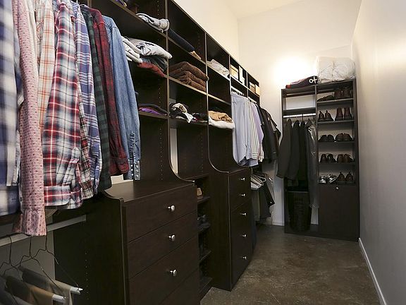 A California Closets system makes the most of the master closet.