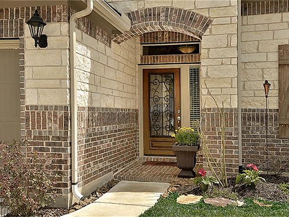 Beautiful entry w wrought iron front door