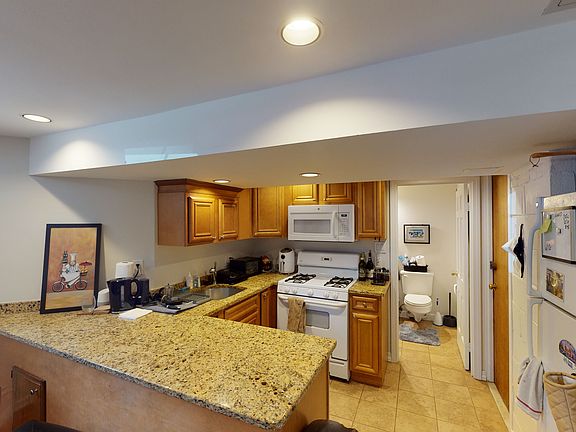kitchen area with large granite countertop - add stools and create a breakfast bar!
