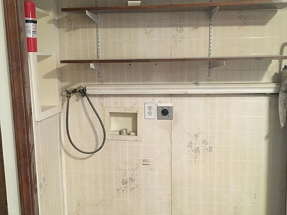 Laundry hook-ups off kitchen