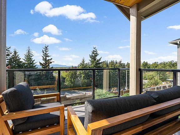 Lively and inviting back deck with a view of the bay