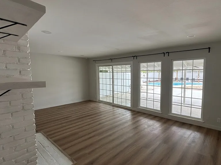 Living room with backyard and pool view and access