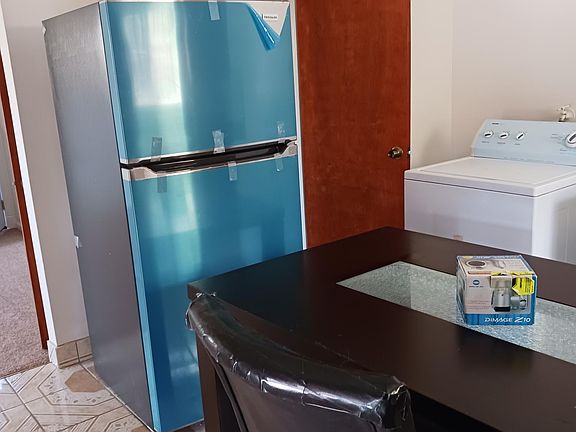 The kitchen has two entries. You can enter the kitchen from the hallway and the living room area.