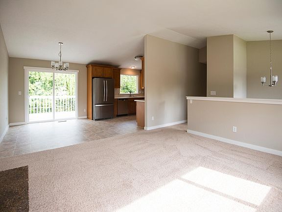 Open, light-filled great room.  New floor coverings, paint, 