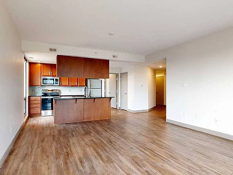 Sleek flooring and an open layout offer the perfect space to personalize and make your own.