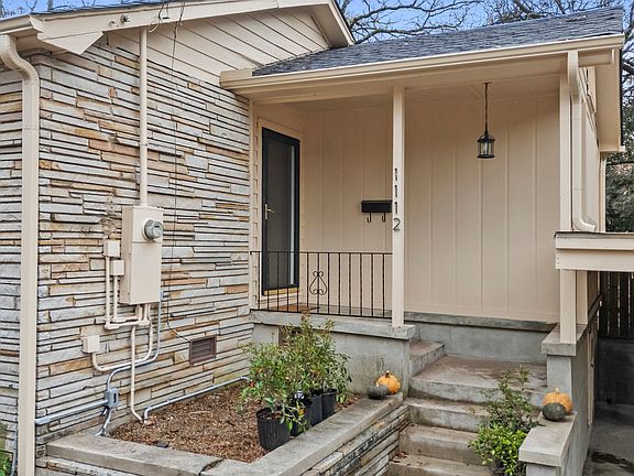 Front planter by front door where water feature is being installed.